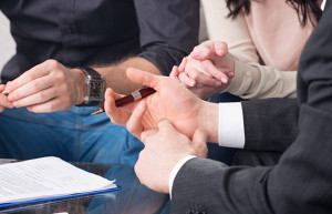 Image of attorney working with clients on their case.