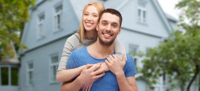 Florida couple standing outside their home that is not carrying enough homeowners insurance